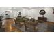 Open-concept space features an airy living room with hardwood floors seamlessly connecting to other areas at 360 Peyton Sw Rd, Atlanta, GA 30311