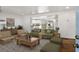 Bright living room open to the kitchen, featuring modern furnishings, hardwood floors and neutral tones at 360 Peyton Sw Rd, Atlanta, GA 30311