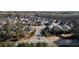 Aerial view of a new construction neighborhood shows winding roads and manicured lawns at 130 Brayden Park Dr, Canton, GA 30115