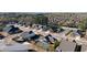 Aerial view of neighborhood featuring modern homes, a pond, and tennis courts at 130 Brayden Park Dr, Canton, GA 30115