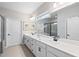 Modern bathroom with double sink vanity, large mirror, and stylish fixtures at 130 Brayden Park Dr, Canton, GA 30115