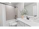 Modern bathroom features a tiled shower over tub, a vanity with clean, stylish lines at 130 Brayden Park Dr, Canton, GA 30115