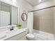 Clean bathroom with a bathtub and shower combination, with stylish mirror and decor at 130 Brayden Park Dr, Canton, GA 30115