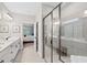 Spacious bathroom boasts a double sink vanity, glass shower, and access to the main bedroom at 130 Brayden Park Dr, Canton, GA 30115