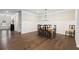 Dining area showcasing hardwood floors, wainscoting, and a table with chairs at 130 Brayden Park Dr, Canton, GA 30115