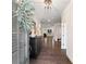 Inviting foyer featuring hardwood floors, a stylish console table, and a view into the open-concept living area at 130 Brayden Park Dr, Canton, GA 30115