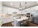 Modern kitchen features stainless appliances, a central island with seating, and ample cabinet space at 130 Brayden Park Dr, Canton, GA 30115