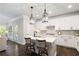 Well-lit kitchen features an island with seating, stainless appliances, and ample counter space at 130 Brayden Park Dr, Canton, GA 30115