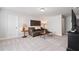 Cozy upstairs living room with comfortable seating, side tables, and tasteful decor at 130 Brayden Park Dr, Canton, GA 30115