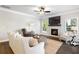 This spacious living room features a fireplace and comfortable seating at 130 Brayden Park Dr, Canton, GA 30115