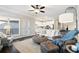 Open living room view featuring a fireplace with a view of the kitchen at 130 Brayden Park Dr, Canton, GA 30115