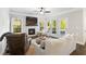 Spacious living room featuring a fireplace, large windows, and lots of natural light at 130 Brayden Park Dr, Canton, GA 30115