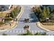 Street view of gated community entry with stone pillars and landscaping at 130 Brayden Park Dr, Canton, GA 30115