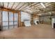 Unfinished basement space with garage door and shelving, perfect for storage and workshop potential at 160 Glenmore Ln, Mcdonough, GA 30253