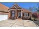 Close up of this brick home's front entrance and attached garage at 160 Glenmore Ln, Mcdonough, GA 30253