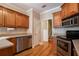 Kitchen with hardwood floors, stainless appliances, and tile backsplash at 160 Glenmore Ln, Mcdonough, GA 30253