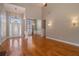 Sunlit living room featuring soaring ceilings and hardwood floors at 160 Glenmore Ln, Mcdonough, GA 30253