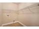 Walk-in closet with wire shelving and space for a washer/dryer at 160 Glenmore Ln, Mcdonough, GA 30253