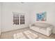 Neutral bedroom with white walls, carpeted floor, sofa, and large window at 3287 Rose Rdg, Atlanta, GA 30340