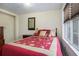 Cozy bedroom with a comfortable bed, window, and a relaxing atmosphere at 3287 Rose Rdg, Atlanta, GA 30340