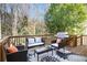 Outdoor deck featuring patio seating and grill with wooded view at 3287 Rose Rdg, Atlanta, GA 30340