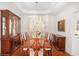 Formal dining room featuring a chandelier, wood furnishings, and elegant decor at 3287 Rose Rdg, Atlanta, GA 30340