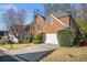 Charming brick two-story home with attached garage and manicured lawn at 3287 Rose Rdg, Atlanta, GA 30340