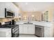 Functional kitchen features stainless steel appliances, and view to the dining area at 3287 Rose Rdg, Atlanta, GA 30340