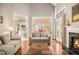 Spacious living room with a fireplace and an open view to the kitchen and dining area at 3287 Rose Rdg, Atlanta, GA 30340