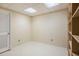 Storage room with built-in shelving and fluorescent ceiling lights at 3287 Rose Rdg, Atlanta, GA 30340