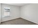 Carpeted bedroom with a window that welcomes natural light at 6910 Winchester Pl, Fairburn, GA 30213