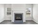 Close up of the fireplace in the living room with windows on either side at 6910 Winchester Pl, Fairburn, GA 30213