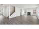 Spacious living room featuring hardwood floors, fireplace and ample natural light at 6910 Winchester Pl, Fairburn, GA 30213