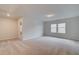 Neutral bonus room with carpet, recessed lighting, and bright natural light from large windows at 254 Arnewood Cir, Mcdonough, GA 30253