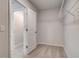 Walk-in closet with carpeting, wire shelving and access to the bathroom at 254 Arnewood Cir, Mcdonough, GA 30253