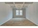 Open dining area with wood floors, modern chandelier, and large window at 254 Arnewood Cir, Mcdonough, GA 30253