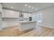 Bright, spacious kitchen featuring an island, stainless steel hood, and abundant cabinet and counter space at 254 Arnewood Cir, Mcdonough, GA 30253