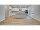 Well-lit kitchen with white cabinetry, stainless steel appliances, and a large center island, ideal for entertaining at 254 Arnewood Cir, Mcdonough, GA 30253