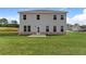 Exterior of a two-story home with a spacious backyard and a patio at 138 Crabbswood Dr, Mcdonough, GA 30253