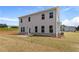 Exterior of a two-story home with a spacious backyard and a patio at 138 Crabbswood Dr, Mcdonough, GA 30253