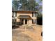 Exterior shot of a two-story townhouse featuring a well-maintained entrance and designated parking at 2340 Beaver Ruin Rd, Norcross, GA 30071