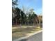 Exterior shot of a community playground featuring play equipment and grassy area at 2340 Beaver Ruin Rd, Norcross, GA 30071