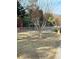 Exterior shot of a community playground featuring mature trees and grassy area at 2340 Beaver Ruin Rd, Norcross, GA 30071