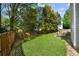 Spacious backyard featuring green grass and patio area with outdoor seating at 2360 Brookgreen Commons, Kennesaw, GA 30144