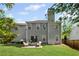 Home exterior featuring a large green backyard and patio seating area at 2360 Brookgreen Commons, Kennesaw, GA 30144