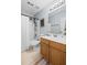 Bathroom featuring a shower and tub with a black shower head and framed mirror above the vanity at 2360 Brookgreen Commons, Kennesaw, GA 30144