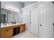 A pristine bathroom boasts a large vanity with double sinks and plenty of storage space at 2360 Brookgreen Commons, Kennesaw, GA 30144