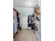A spacious walk-in closet provides ample space for clothing and shoe storage at 2360 Brookgreen Commons, Kennesaw, GA 30144