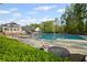 Relax and unwind at the community pool, featuring ample seating and a serene atmosphere at 2360 Brookgreen Commons, Kennesaw, GA 30144