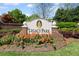 Beautiful Legacy Park entrance sign surrounded by colorful flowers and greenery at 2360 Brookgreen Commons, Kennesaw, GA 30144